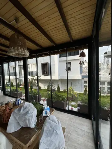 Bursa sürme cam balkon, ahşap tavanlı teras